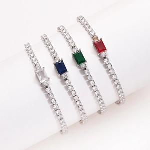 Detailed view of tennis bracelets with rectangular emerald-cut colored zircons