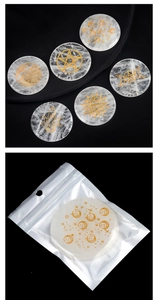 Macro shot of 6 white crystal rune stones with gold engraved celestial symbols in poly bag