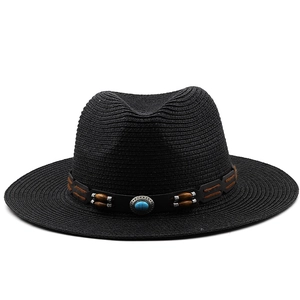 Detail of black straw fedora with ethnic style beads and blue stone decorative band