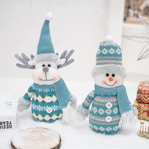 Blue and white knitted Christmas reindeer and snowman plush dolls for festive table decor