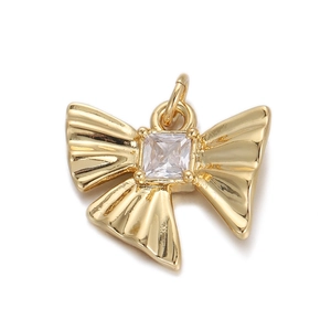 Detail of 18K gold butterfly pendant with a square clear crystal center on white background