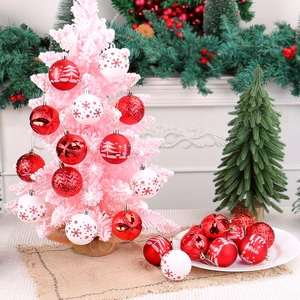 Assorted red and white painted Christmas baubles set for festive tree decoration