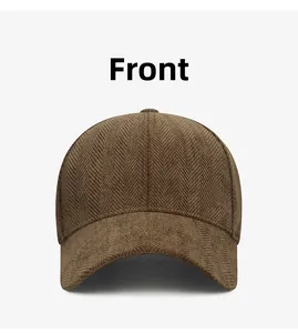 Front view showing the vintage herringbone fabric texture of the dark brown baseball cap