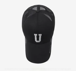 Top view of black mesh baseball cap with U ECHOES embroidery and extended sports brim