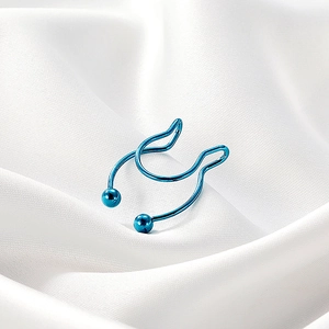 Close-up of blue U-shaped non-piercing stainless steel nose ring on white silk background