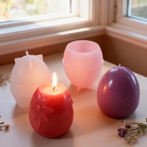 DIY embossed floral egg candle silicone molds with finished scented candles on a ledge