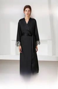 Close-up of elegant black satin robe featuring intricate silver lace detail on the sleeves
