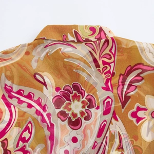 Detail of paisley print chiffon shirt collar with lightweight floral fabric texture