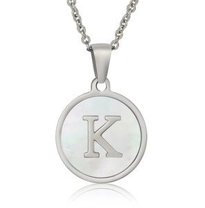 Close-up of silver stainless steel necklace featuring a white shell pendant with letter K