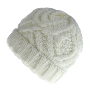 Detail of chunky cable knit pattern and folded brim on cream white winter beanie