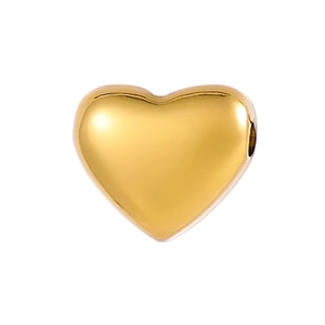 Macro shot of gold heart-shaped stainless steel bead with side hole for DIY jewelry