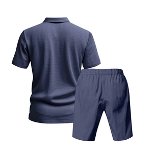 Back view of men's casual linen polo shirt and shorts set in haze blue with textured fabric