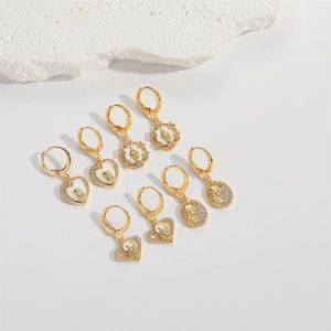 Golden religious heart and round earrings set with Virgin Mary portraits and white zircons