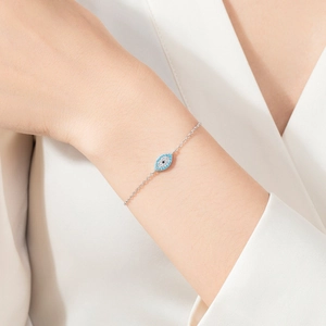 Elegant S925 sterling silver evil eye bracelet featuring blue and clear zircon stones