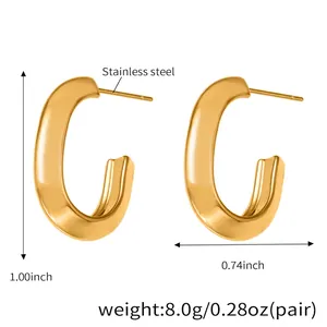 Macro shot of polished gold stainless steel C-shape earrings with size measurements