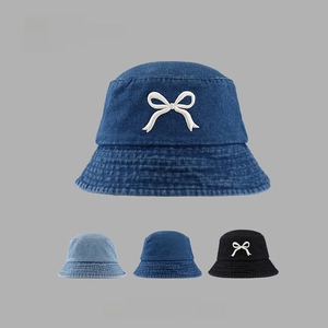 Denim bucket hat with bow embroidery in blue and black colors for summer sun shade