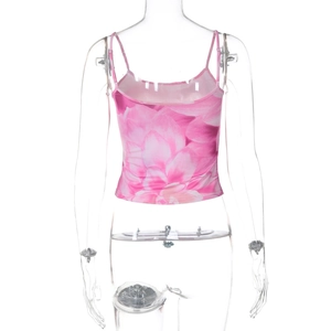Detail of pink floral crop top featuring a deep U-shaped back and silky fabric texture