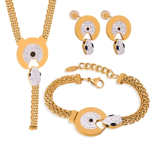 Gold snake-themed jewelry set with sparkling diamonds including necklace, bracelet and earrings