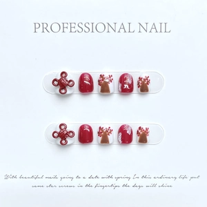 Handmade red and white press-on nails for kids with 3D Chinese knot and floral art