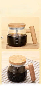 Detail view of electric self-stirring glass mugs in battery and rechargeable versions