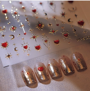 Macro shot of M-522 star and moon heart nail stickers with gold foil metallic finish