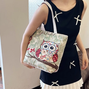 Ethnic woven canvas tote bag featuring a colorful cartoon owl embroidery for women