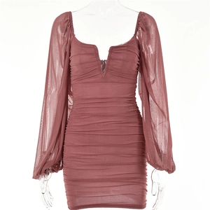 Detail view of deep reddish-brown mesh mini dress with long puff sleeves and V-neckline