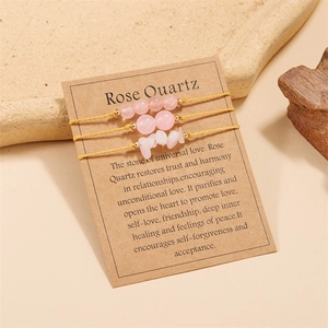 Detailed set of three rose quartz bracelets on display card with yellow woven cord