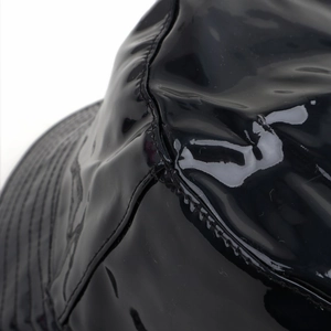Laser gradient PU leather bucket hat with shiny black finish and detailed stitching