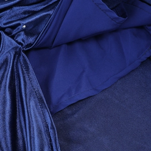 Macro detail of starry blue evening gown showing glitter rhinestones and layered fabric