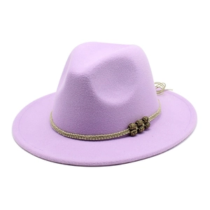 Detail of lavender wool jazz hat featuring khaki braided rope and antique bronze metal beads