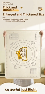 Detail of food-grade silicone baking mat with dog pattern and size measurement scales