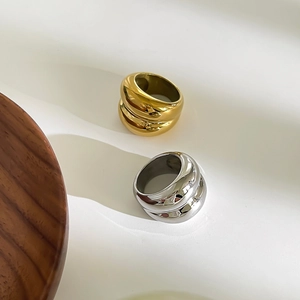 Modern chunky 18k gold and silver plated titanium rings with spiral ripple texture