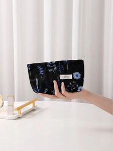Linen canvas makeup bag with blue floral embroidery and zipper for cosmetics storage