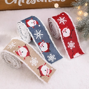 Christmas ribbon set with Santa Claus and snowflakes, plush trim edges on snowy background