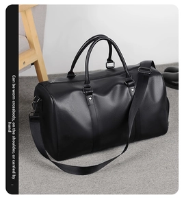 Black leather travel bag with dual handles and detachable shoulder strap for 3-way carry