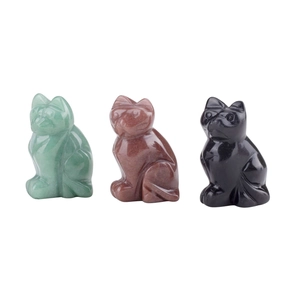 Detailed view of three polished gemstone cat figurines in green, brown and black