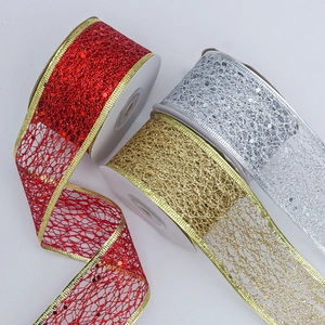 Detail of red, gold and silver glitter mesh ribbons with wire edges for holiday decor