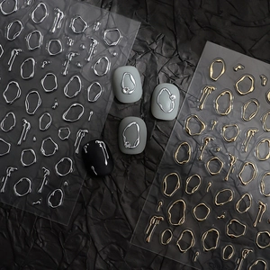 Golden and silver irregular fluid metallic nail art stickers with textured 3D line designs