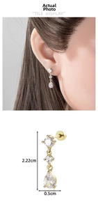 Detail shot of gold drop zircon pendant earrings showing size dimensions 2.22cm by 0.5cm