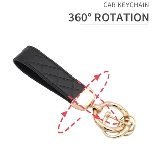 Car keychain featuring black diamond pattern leather strap and 360-degree rotating gold clip