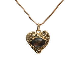 Golden heart pendant necklace with hammered texture and dark oval gemstone inlay