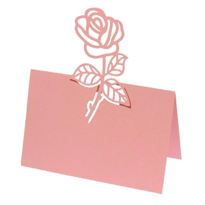Detail of pink laser-cut rose place card made of premium pearlescent paper for weddings