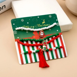 Three-piece Christmas beaded bracelet set with Santa, bell, and stocking enamel charms