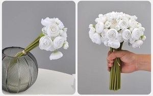 Realistic white silk Persian Buttercup bouquet displayed in a textured glass vase