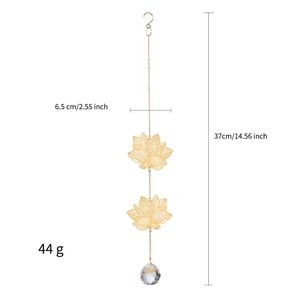 Detailed view of golden lotus suncatcher with crystal prism and size measurements