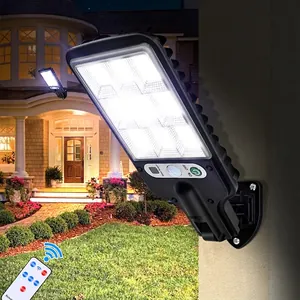 Solar outdoor wall light with motion sensor and remote control on a garden wall