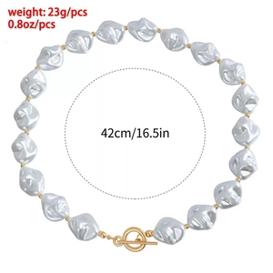 Detailed view of baroque pearl necklace with vintage gold OT clasp and size markings