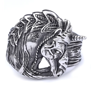 Close-up of vintage unicorn ring in antique silver finish with detailed relief carving