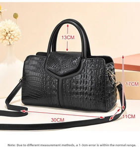 Detailed view of crocodile pattern Boston handbag with dimensions 30x17x11cm